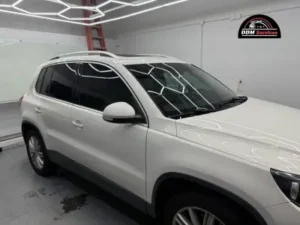 A technician applying a protective ceramic coating.
