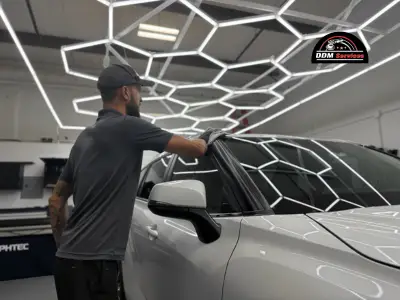 Automotive technician applying ceramic coating