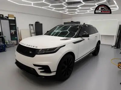 A technician applying a protective ceramic coating.