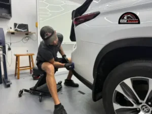 Professional detailer wiping down