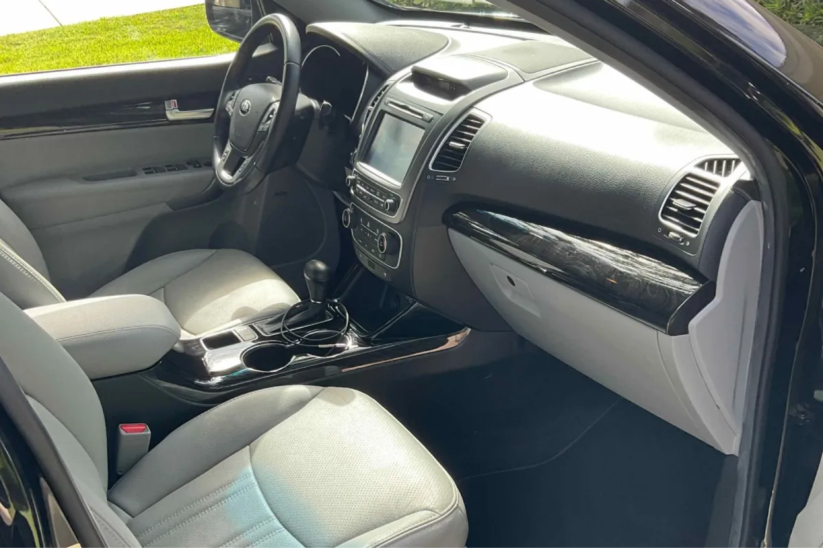 Interior of a Kia with gray seats and a modern dashboard.