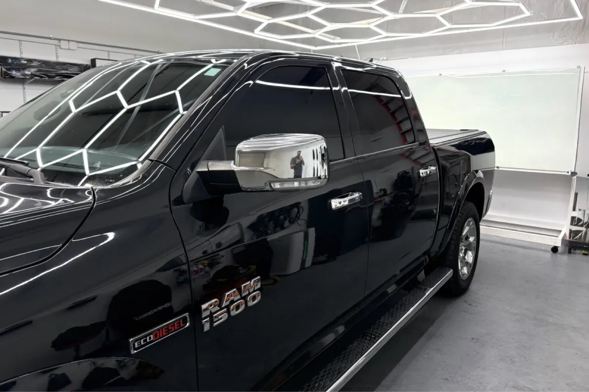 Black car featuring premium automotive window tint.