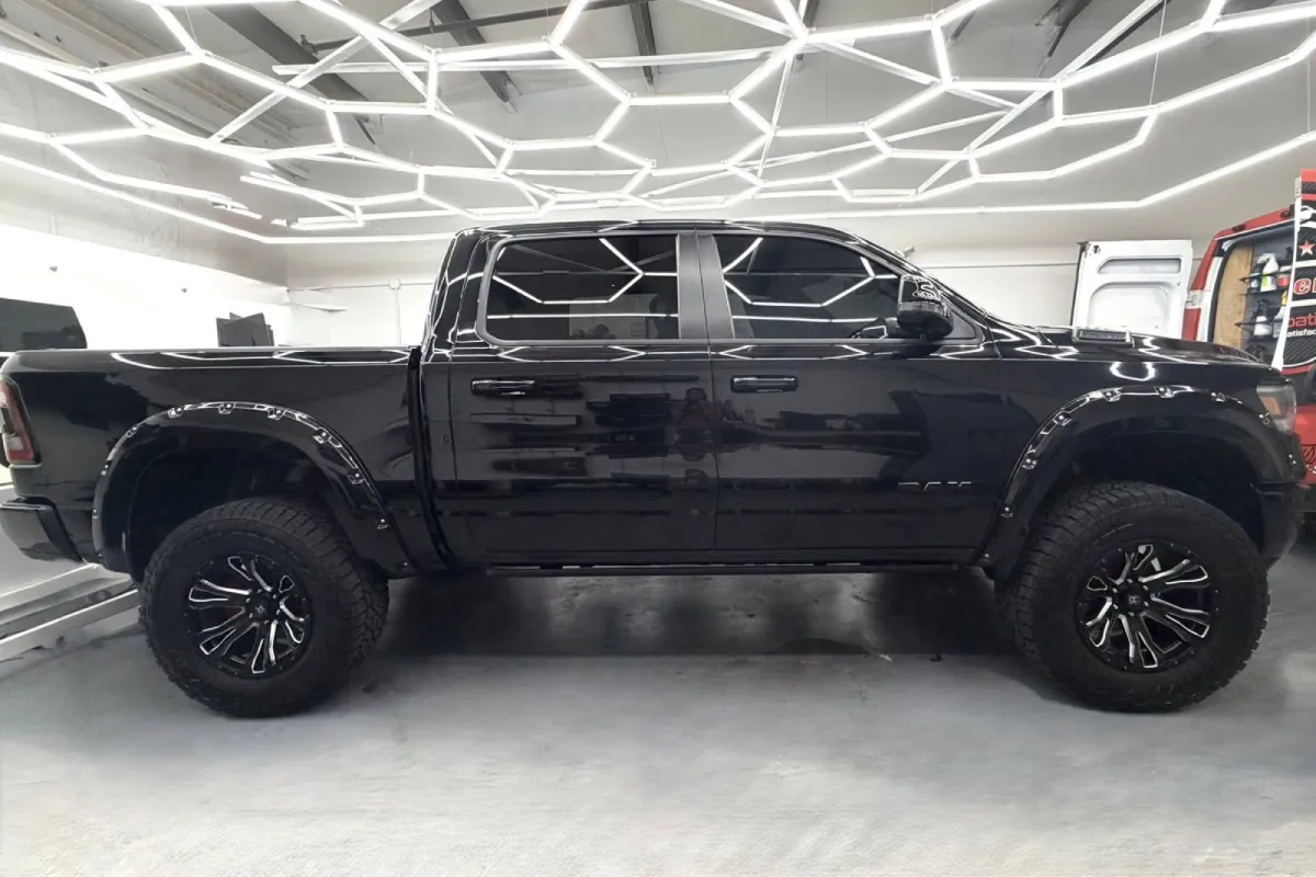 Black truck with dark window tint installed.